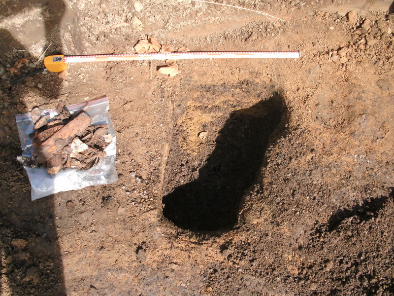 Toilet pit and some of the artefacts retrieved.